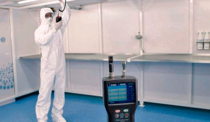 Man in cleanroom testing environment wearing white hazmat suit